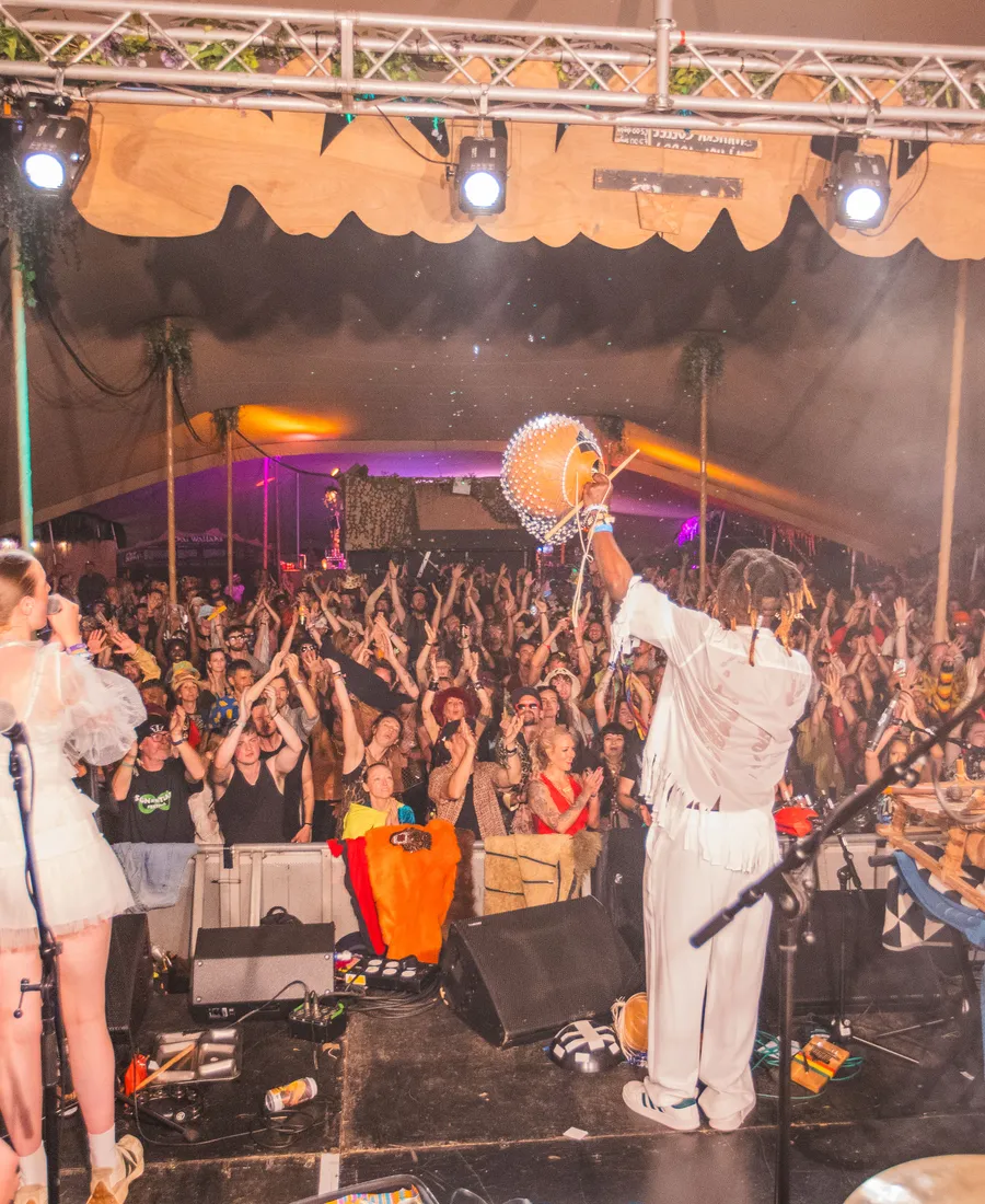A band on the Chai Wallahs stage in front of a packed crowd